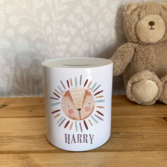 Super cute boho lion personalised money pot / money bank / piggy bank. Professionally printed by us in our home studio onto a white ceramic money box. Comes with a plastic stopper in the bottom for easy money/penny removal. 