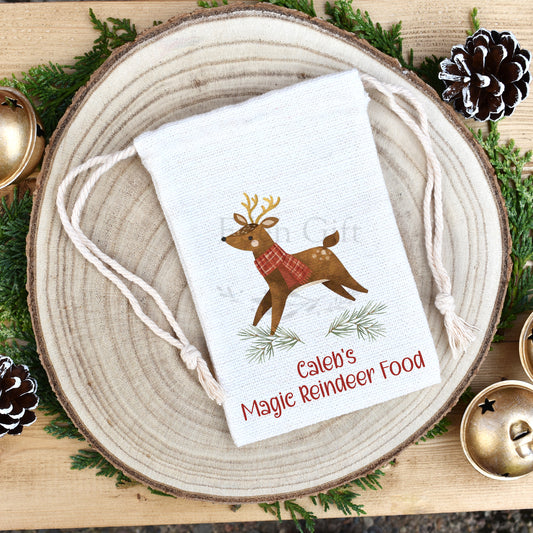 personalised magic reindeer food bag or pouch. Customised with your child's name. Country style, traditional christmas reindeer with a red tartan scarf. also available as a green version. 